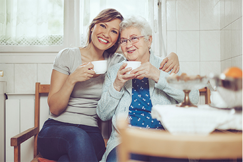 carer and patient having cup of tea